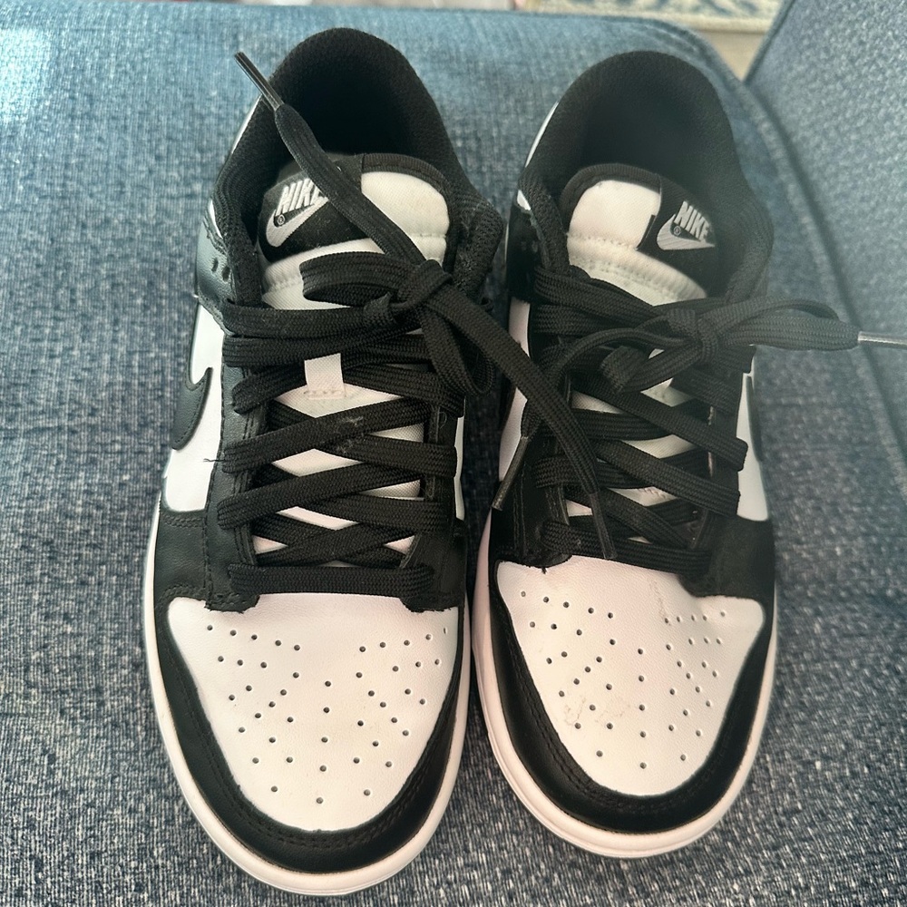 Women’s black Nike panda dunk sneakers